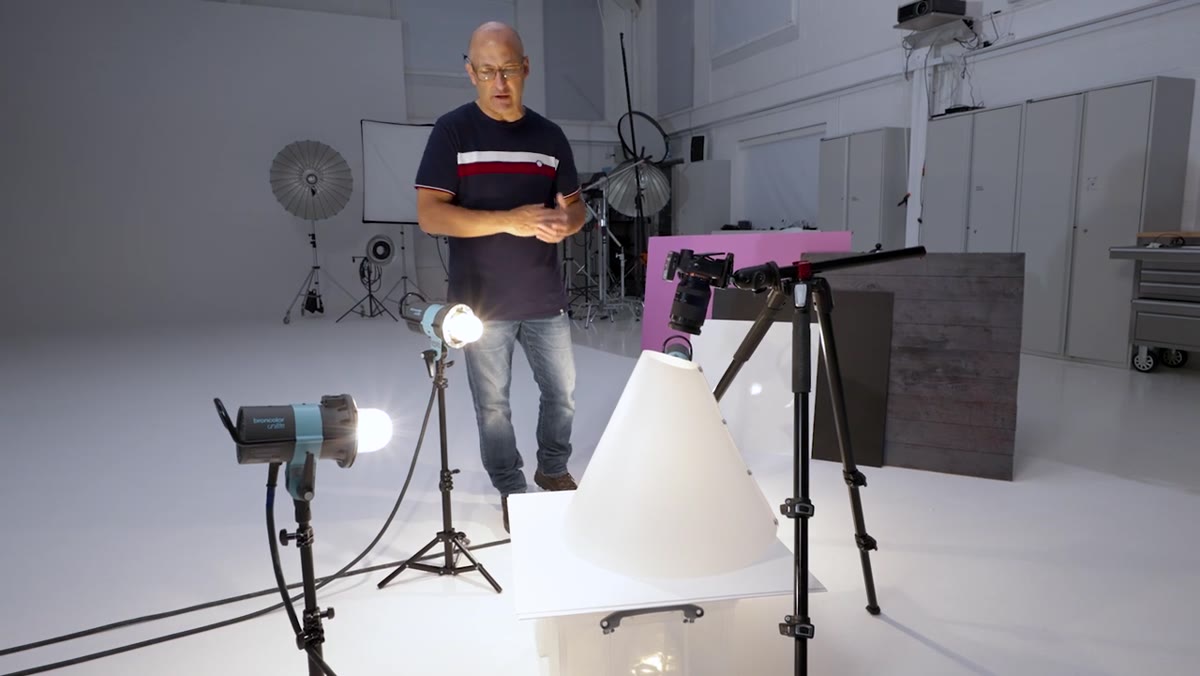 White acrylic surface under product inside light cone