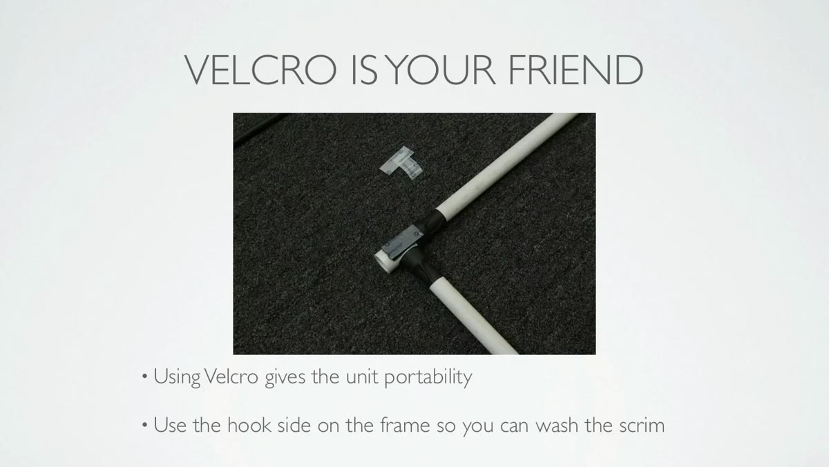 Close-up of velcro being applied to PVC pipe section