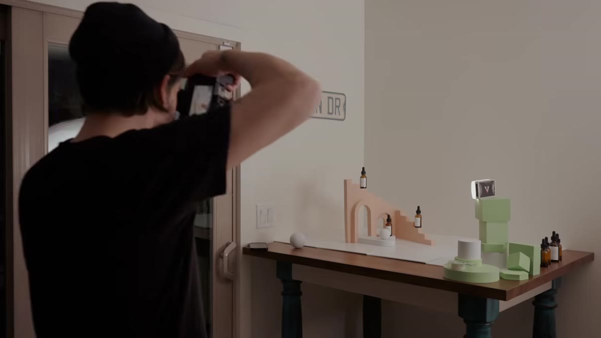 Arch props placed in front and behind product to create layered depth