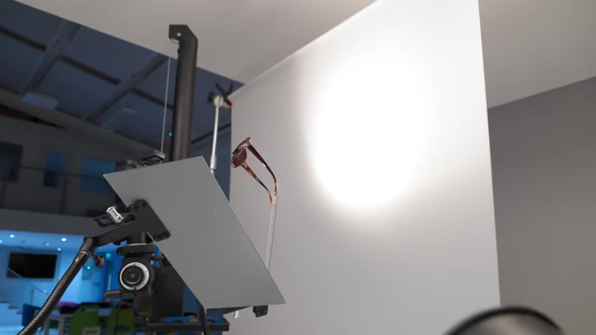 Small Fresnel spotlight aimed through tortoise shell sunglass lenses