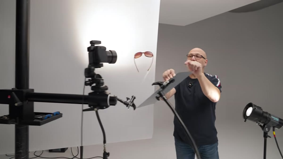 Small mirror positioned to bounce light onto one arm of the sunglasses