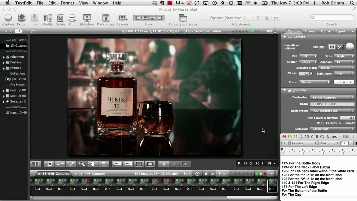 Digital tech reviewing shot list to verify all components captured