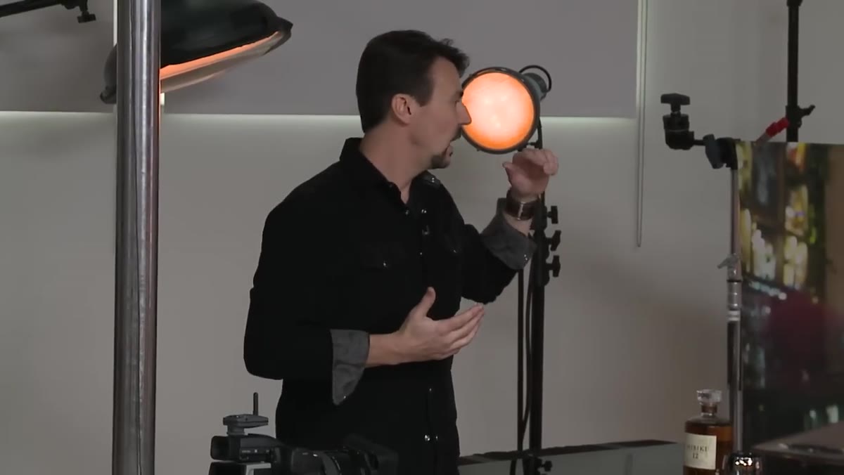 Wide shot of studio with multiple strobe heads being positioned