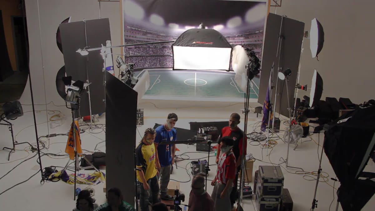 Large softbox positioned behind talent, rim light visible on hair
