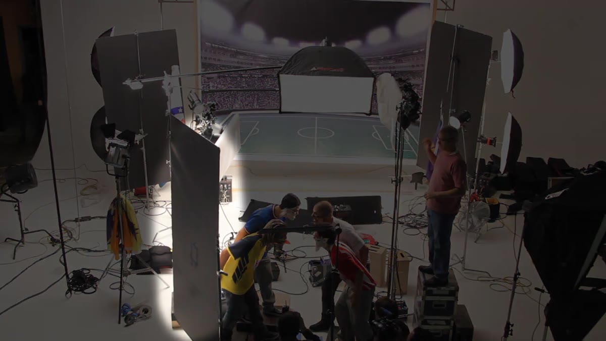 Foam core fill pushed in camera left, umbrella behind camera as front fill