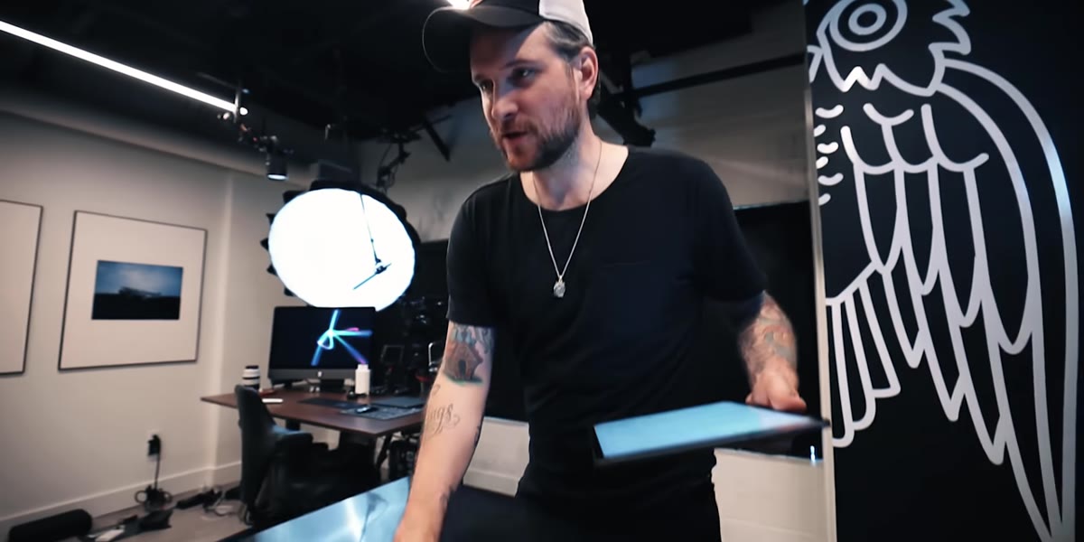 McKinnon examining the wood surface and ring together