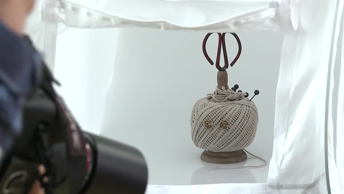 Andrew preparing to shoot wide then zoom in on earring detail
