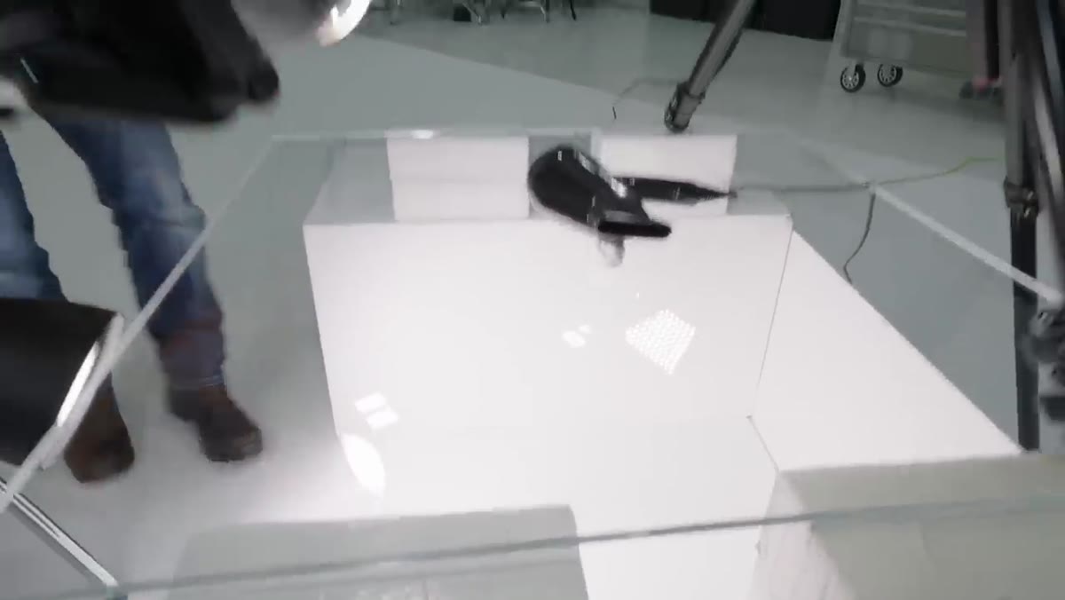 White reflector panel positioned behind the setup