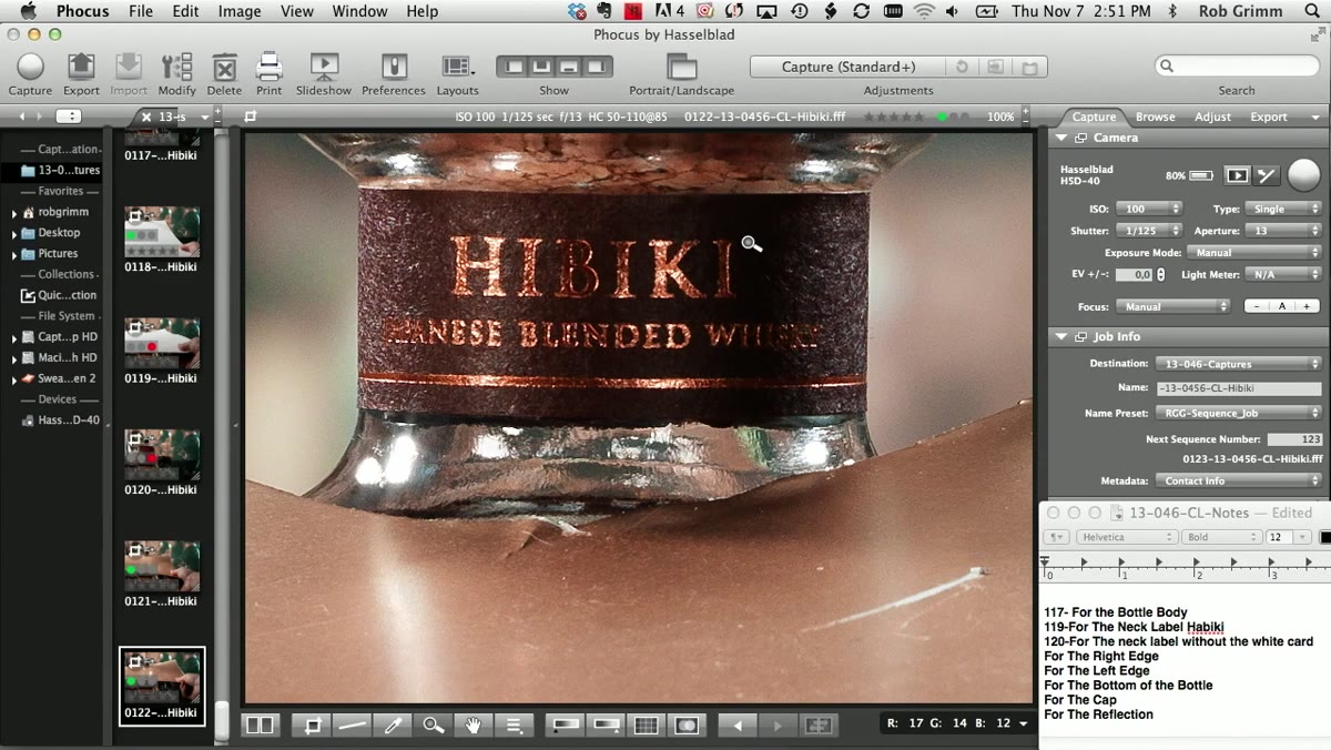 Gold reflector card positioned beside a bottle in the studio
