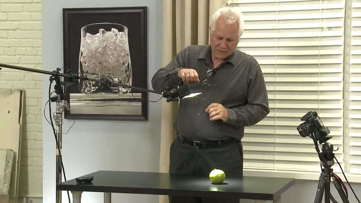 Instructor demonstrating the bare LED light source on the apple